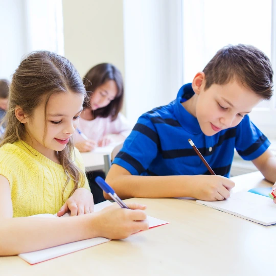 A student revising with notes while preparing for an exam