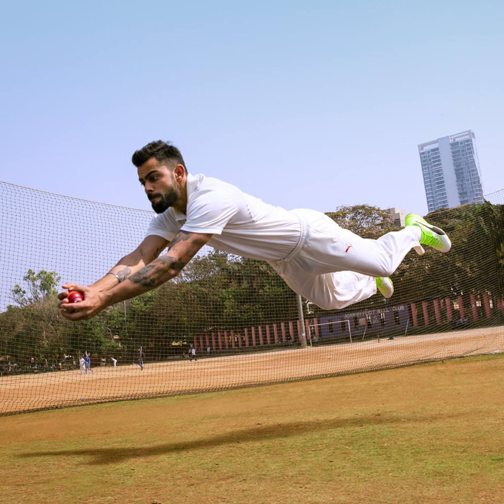 Virat Kohli celebrating a century during a one-day international